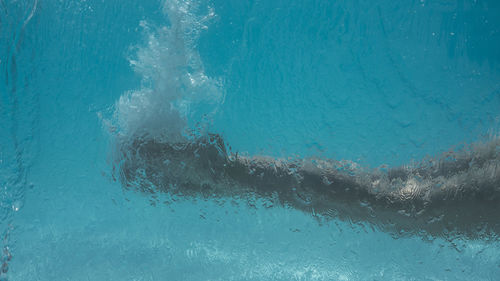 Man swimming in pool