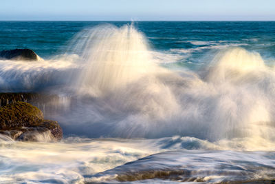 Waves crashing on the rocks during high tide