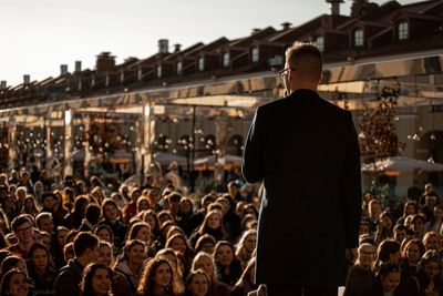 Rear view of people looking at music festival