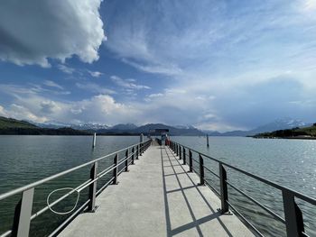 Pier over sea against sky