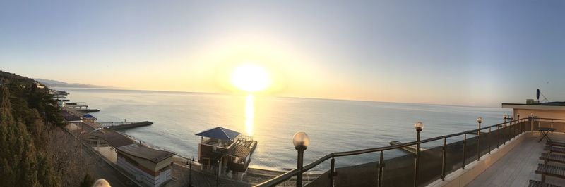 Scenic view of sea against clear sky during sunset