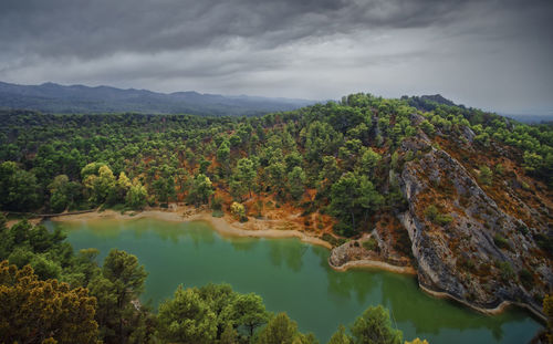 Scenic view of lake and mountains against sky