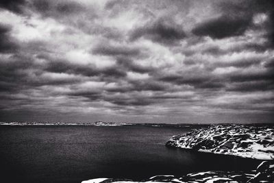 Scenic view of sea against cloudy sky