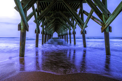 Pier over sea against sky