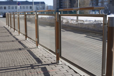 Fence from road. place for pedestrians. fence on side of road. stopping place.