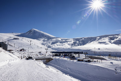 Scenic view of snowcapped mountains against sky