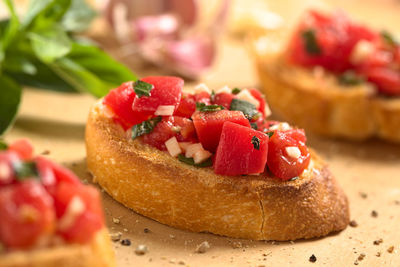 Close-up of chopped fruits in plate on table