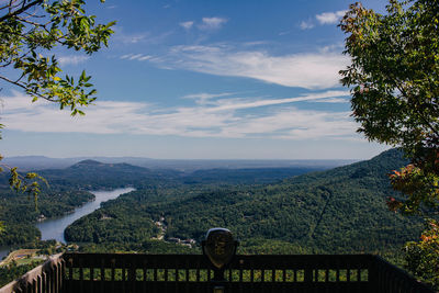 High angle view of coin-operated binoculars against river and mountains