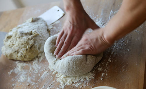 Woman baking bread at home