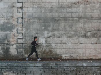 Man standing on wall