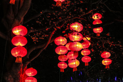 Illuminated lanterns hanging at night