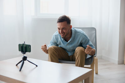 Portrait of senior man using digital tablet at home