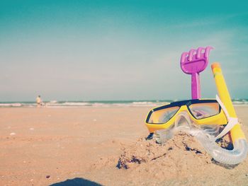 Lifeguard hut on beach against sky