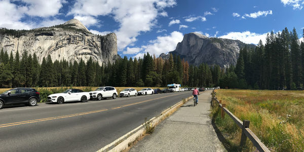 Cars on road against sky