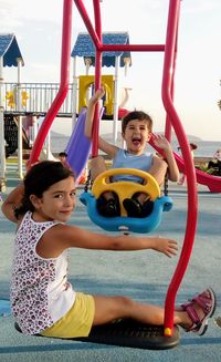 Siblings playing at playground