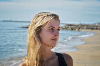 Portrait of beautiful young woman on beach