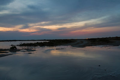 Scenic view of sea against sky at sunset