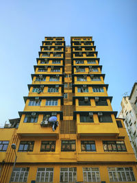 Yellow building, city, urban areas, building, low key angle, street