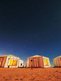 Low angle view of building against clear sky at night