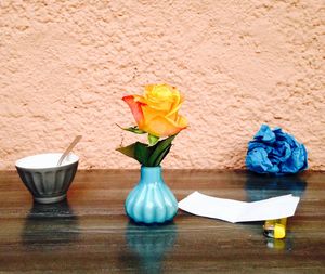 Yellow flowers on wooden table