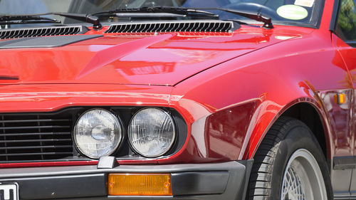 Close-up of vintage car parked in city