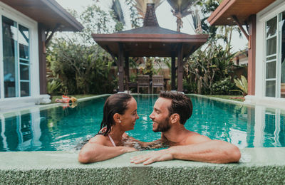 Woman relaxing in swimming pool