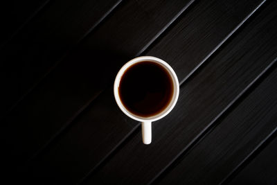High angle view of coffee cup on table