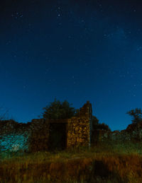 Abandoned building against sky at night