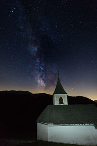 Church against sky at night