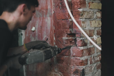Side view of man working at workshop