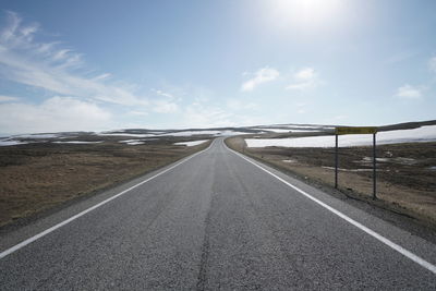 Empty road along landscape