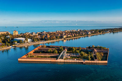 Flying over small venice islands in venetian lagoon.