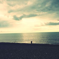 Scenic view of sea against cloudy sky