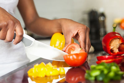 Midsection of man preparing food in kitchen