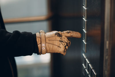 Close-up of hand holding metal