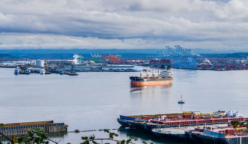 Ship at harbor against sky