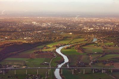 High angle view of river amidst buildings in city