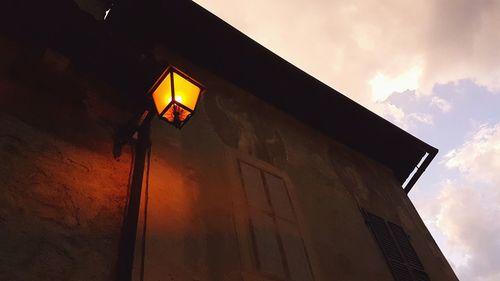 Low angle view of illuminated building against sky