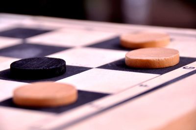 Close-up of chess pieces on table