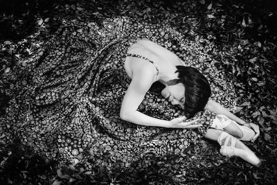 High angle view of woman lying on floor