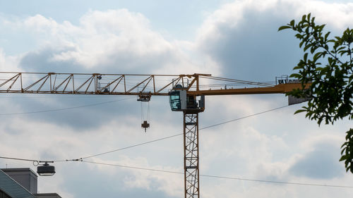 Low angle view of construction crane against sky
