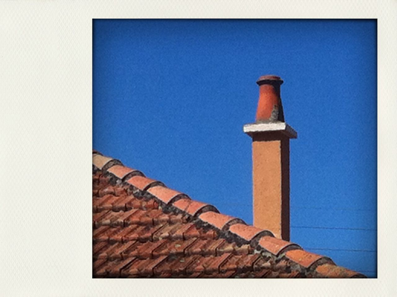 building exterior, architecture, built structure, blue, clear sky, low angle view, copy space, high section, wall - building feature, protection, house, day, safety, outdoors, no people, security, roof, wall, tower, building