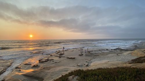 Scenic view of sea against sky during sunset