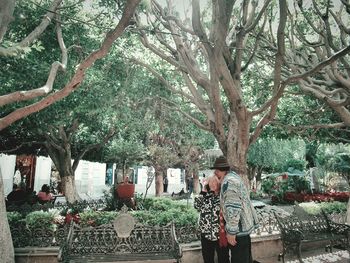 People standing by tree