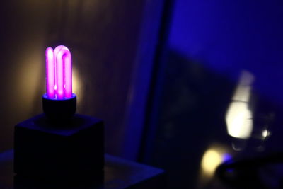 Close-up of illuminated lamp against blurred background