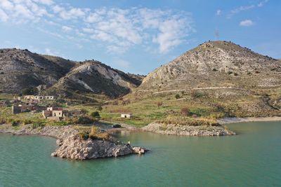 Panoramic view of buildings and mountains against sky