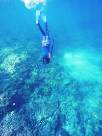 Boy swimming in sea