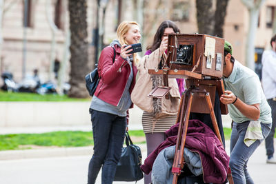 Woman photographing with camera