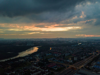 High angle view of buildings against sky at sunset