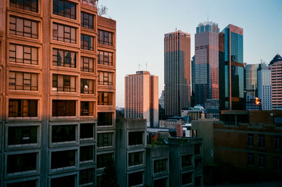 Cityscape against sky during sunset